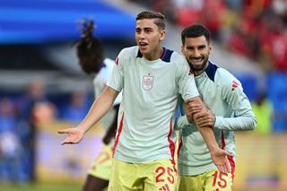 Spain 2024 Olympics squad Spain's forward #25 Fermin Lopez and Spain's midfielder #15 Alex Baena warm up ahead of the UEFA Euro 2024 Group B football match between Albania and Spain at the Duesseldorf Arena in Duesseldorf on June 24, 2024. (Photo by PATRICIA DE MELO MOREIRA / AFP) (Photo by PATRICIA DE MELO MOREIRA/AFP via Getty Images)