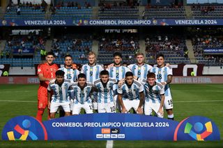 Argentina 2024 Olympics squad Argentine players pose for a picture before the beginning of the Venezuela 2024 CONMEBOL Pre-Olympic Tournament football match between Brazil and Argentina at the Brigido Iriarte stadium in Caracas on February 5, 2024. (Photo by Federico Parra / AFP) (Photo by FEDERICO PARRA/AFP via Getty Images)